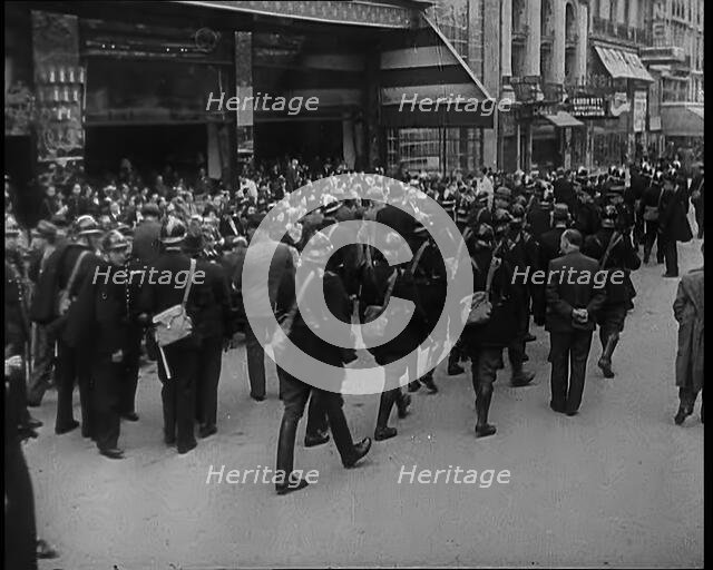 French Police Checking People's Papers Outside a Cafe in Paris, 1940. Creator: British Pathe Ltd.