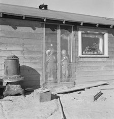Two of the seven Browning children in doorway of their Oregon home, Dead Ox Flat, Oregon, 1939. Creator: Dorothea Lange.
