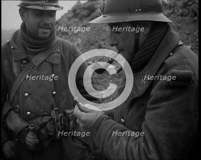 Two French Soldiers Standing in a Trench and One is Smoking a Pipe, 1939. Creator: British Pathe Ltd.