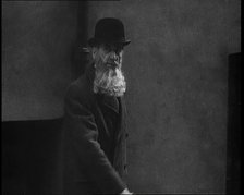 A Man Sporting a Beaver Beard Walking Along a Street, 1922. Creator: British Pathe Ltd.