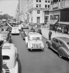 Traffic on Fifth Avenue approaching 57th Street on a summer afternoon, New York City, 1939. Creator: Dorothea Lange.