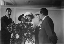 Irving Bertman presents flowers to Helen Keller, Flower Show, 1913. Creator: Bain News Service.