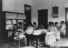 Carlisle Indian School, Carlisle, Pa. Clothes mending class, 1901. Creator: Frances Benjamin Johnston.