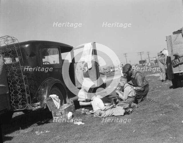 Oklahomans bound for Oregon along a highway in California, 1937. Creator: Dorothea Lange.