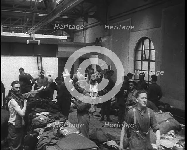 British Soldiers Receiving New Uniforms Back at Camp, 1940. Creator: British Pathe Ltd.