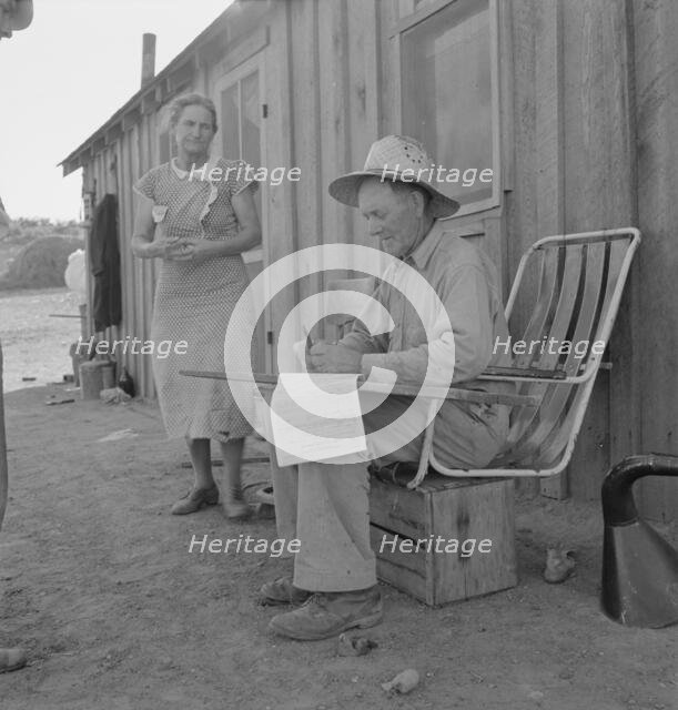 Oklahoma farmer, now living in Cow Hollow, is a FSA borrower, Malheur County, Oregon, 1939 Creator: Dorothea Lange.