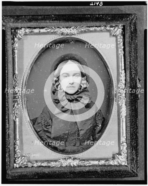 Unidentified woman, head-and-shoulders portrait, facing front, between 1851 and 1860. Creator: Rufus Anson.