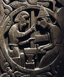 Stave church carving with a scene from the story of Sigurd.