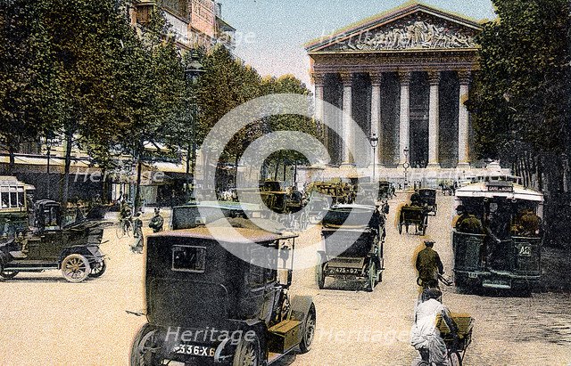 Rue Royale and the Madeleine, Paris, with cars and a motorbus on the street, c1900. Artist: Unknown