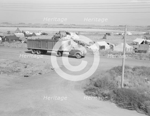 Camp of migrant potato pickers seen from potato shed..., Tulelake, Siskiyou County, California, 1939 Creator: Dorothea Lange.