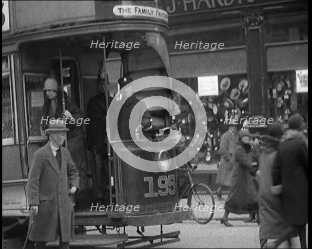 Volunteer Male Civilian Conducting a Tram With a Police Escort Sitting Beside Him, 1926. Creator: British Pathe Ltd.