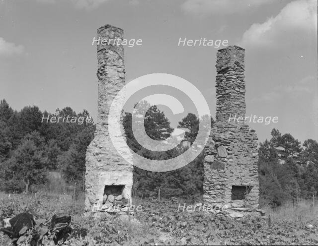 Standing chimneys of an old plantation house, Georgia, 1937. Creator: Dorothea Lange.