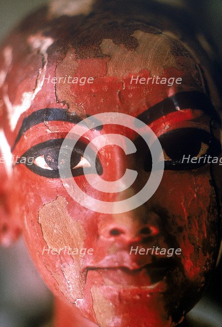 Closeup of head of Tutankhamun as a child emerging from a lotus flower. Artist: Unknown