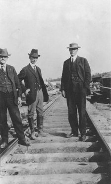 At the new railroad left to right are: Mr. Edes, Frank G. Carpenter,..., between c1900 and 1916. Creator: Unknown.