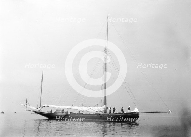 The gaff yawl 'Coral' at anchor, 1922. Creator: Kirk & Sons of Cowes.