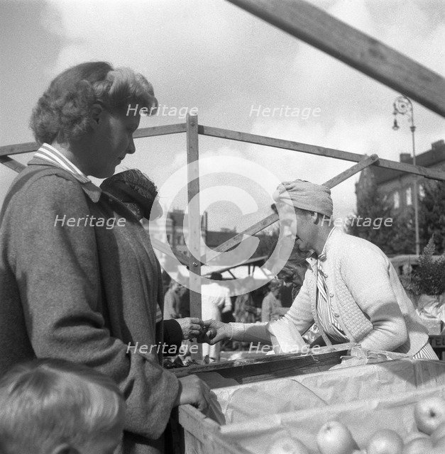 Fruit and vegetable stall in the market, Malmö, Sweden, 1947. Artist: Otto Ohm