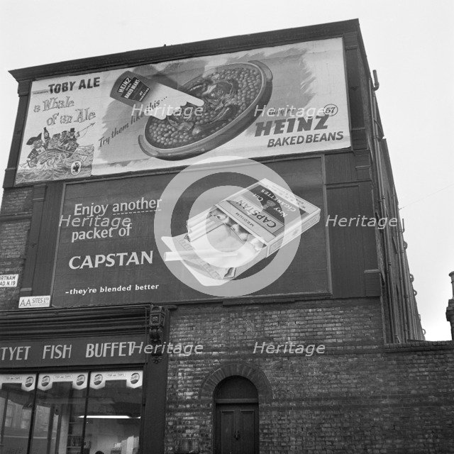 Advertising hoardings, Fortnam Road, Holloway, London, 1960-1965. Artist: John Gay