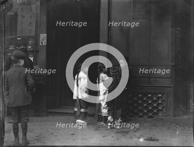 His first cigar, Chinatown, San Francisco, between 1896 and 1906. Creator: Arnold Genthe.
