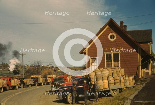 Trucks outside of a starch factory, Caribou, Aroostook County, Maine. , 1940. Creator: Jack Delano.