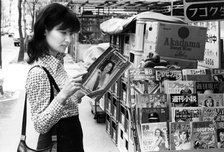 A woman buying a magazine, Tokyo, Japan, 1975. Artist: Unknown
