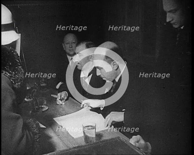 Woman Talking to Four Men Sitting at a Desk, 1933. Creator: British Pathe Ltd.