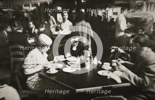 Office workers lunching in a restaurant, New York, USA, early 1930s. Artist: Unknown