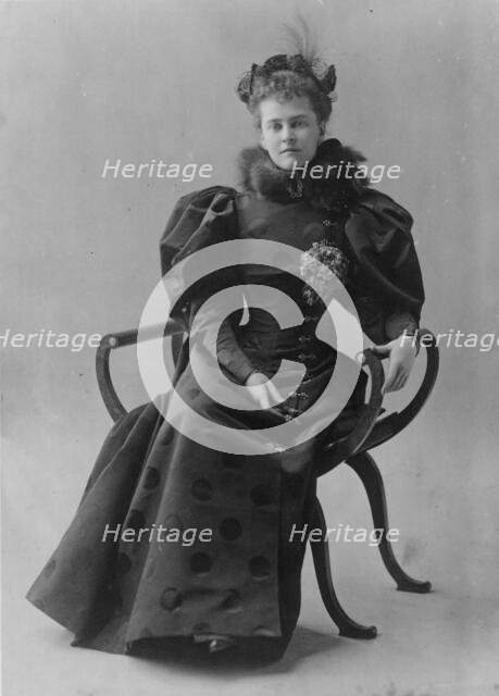Mrs. Elizabeth Cameron, full-length portrait, seated, facing front, between c1890 and c1910. Creator: Frances Benjamin Johnston.