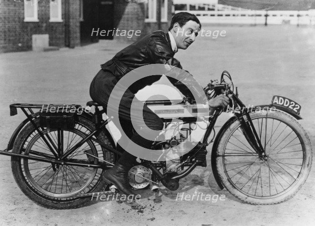 F Ball riding a 1913 Douglas motorbike, (c1913?). Artist: Unknown