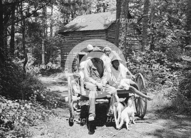 Colored sharecropper and his children about to leave..., Shoofly, North Carolina, 1939. Creator: Dorothea Lange.