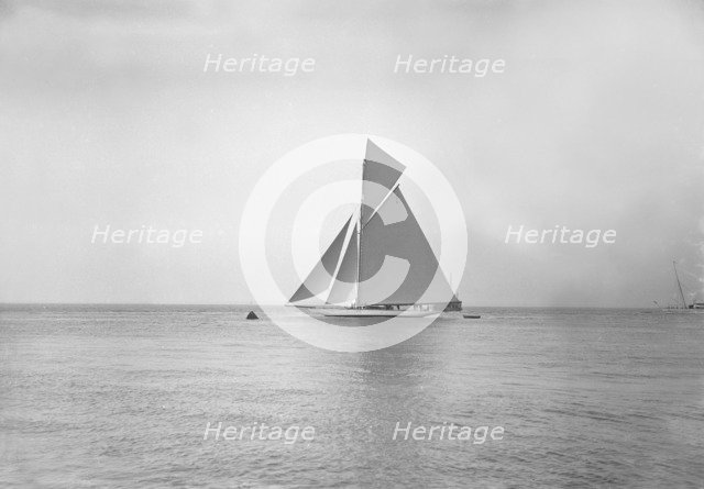 The 19-metre cutter 'Norada' sailing in gentle winds, 1911. Creator: Kirk & Sons of Cowes.