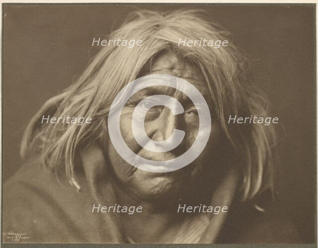 An Apache, 1903. Creator: Edward Sheriff Curtis.
