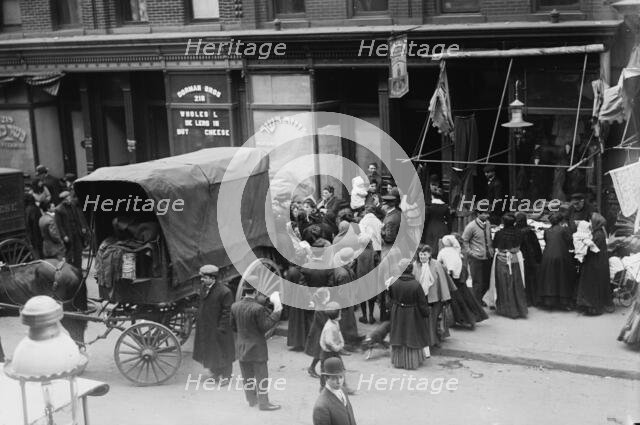 Crowd gathered in front of butcher shop during meat riot, New York, 1910. Creator: Bain News Service.