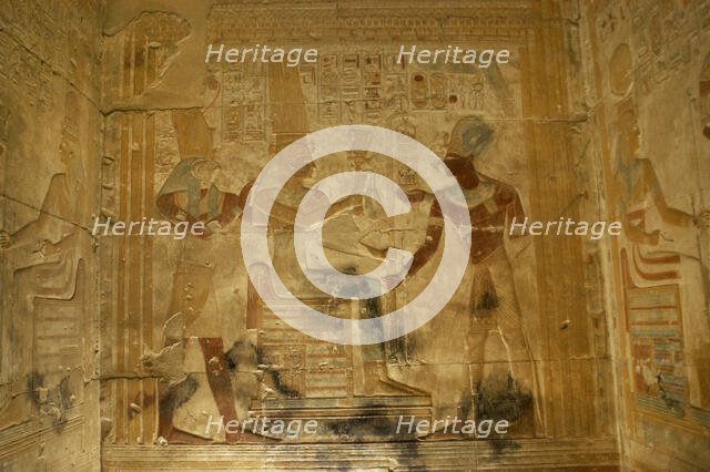 Pharaoh Seti I before the goddess Isis..., Temple of Seti I, Abydos, Egypt, New Kingdom (2003). Creator: LTL.