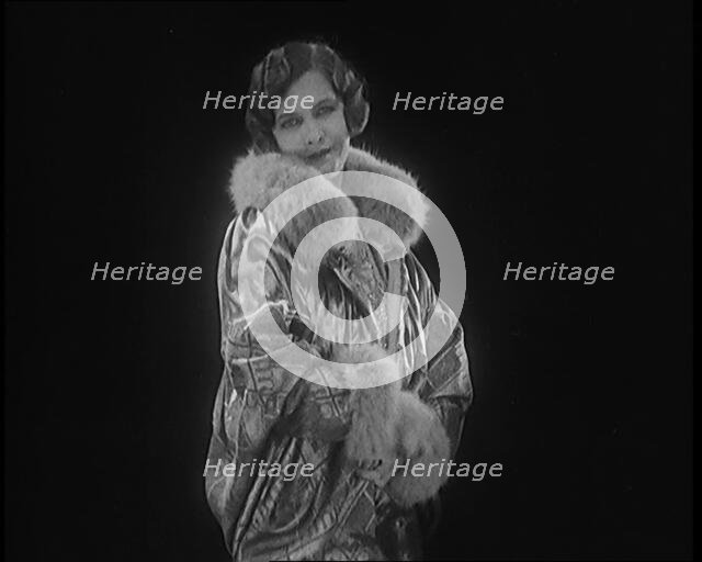 Female Civilian Modelling a Glamorous Fur Trimmed Coat, 1920. Creator: British Pathe Ltd.