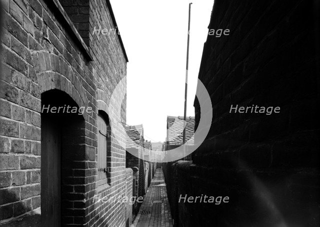 Rear alley of Hammond Street, Tunstall, the Potteries, Staffordshire, 1960. Artist: Herbert Felton