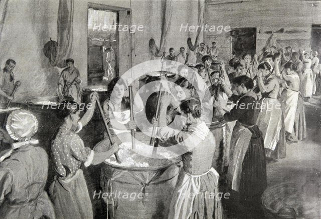 Workmen kneading the roses in fat to obtain an ointment where the perfume will be..., 1922. Creator: Etienne Cournault  (1891-1948).