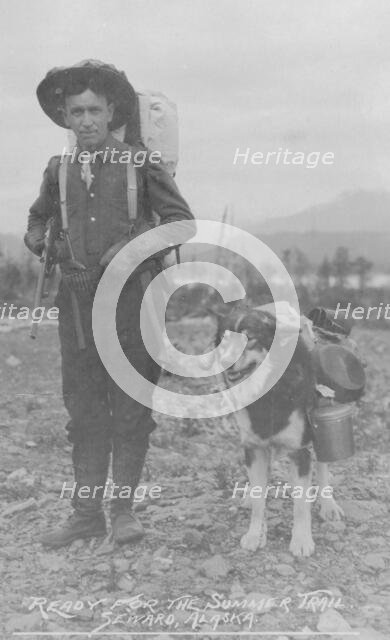 Prospector and dog ready for the summer trail, between c1900 and 1916. Creator: Unknown.