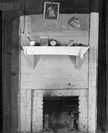 Fireplace in bedroom of Floyd Burroughs' cabin, Hale County, Alabama, 1936. Creator: Walker Evans.