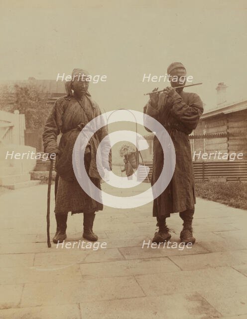 Two Chinese musician street performers in the upper yard, Dom Smith, Vladivostok, Russia, 1899. Creator: Eleanor Lord Pray.