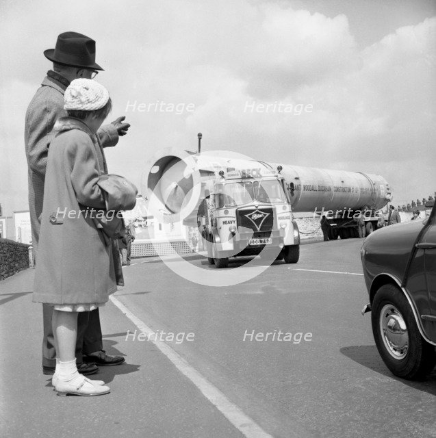 An absorption tower being transported by road, Dukenfield, Manchester, 1962. Artist: Michael Walters