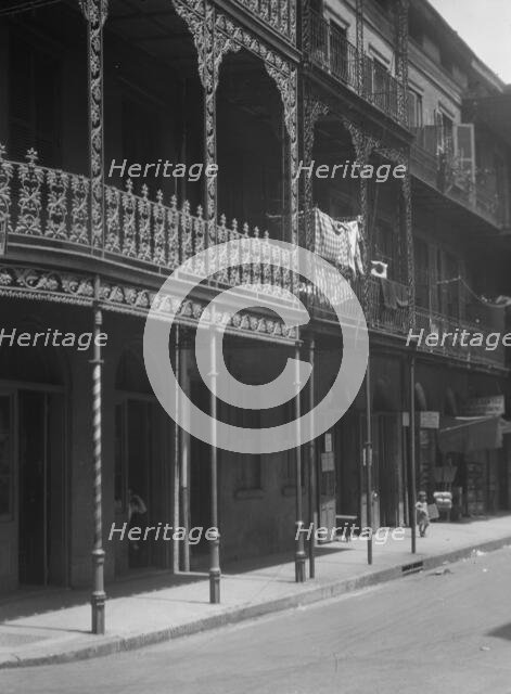 Street scene in the French Quarter, New Orleans, between 1920 and 1926. Creator: Arnold Genthe.