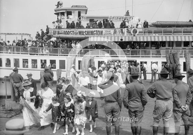 National Guard of D.C., Women And Children Leaving Boat On Return of M. And M. And N.G., 1916. Creator: Harris & Ewing.