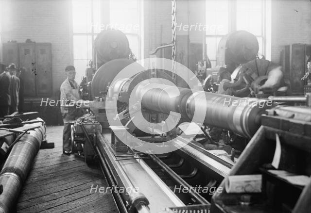 Navy Yard, U.S., Washington - Turning, Examining And Boring A 5 Inch, 50 Cal. Gun, 1917. Creator: Harris & Ewing.