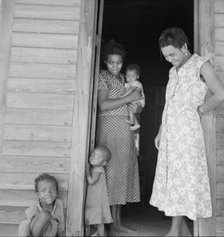 Two tobacco tenant mothers (related) with part of their children, Wake County, North Carolina, 1939. Creator: Dorothea Lange.