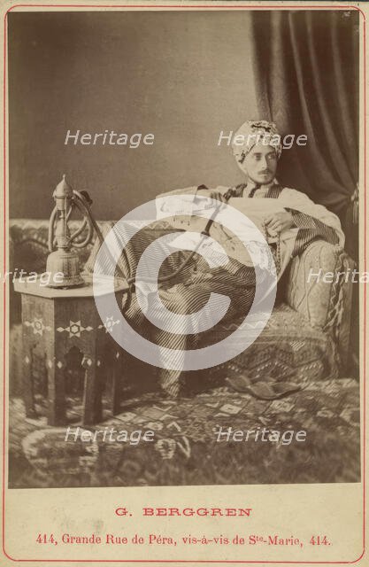Marquis Claes Lagergren (1853-1930) in eastern costume smoking a hookah. Creator: Guillaume Berggren.