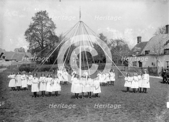 Village children taking part in the maypole dance at East Hanney, Oxfordshire, c1860-c1922. Artist: Henry Taunt