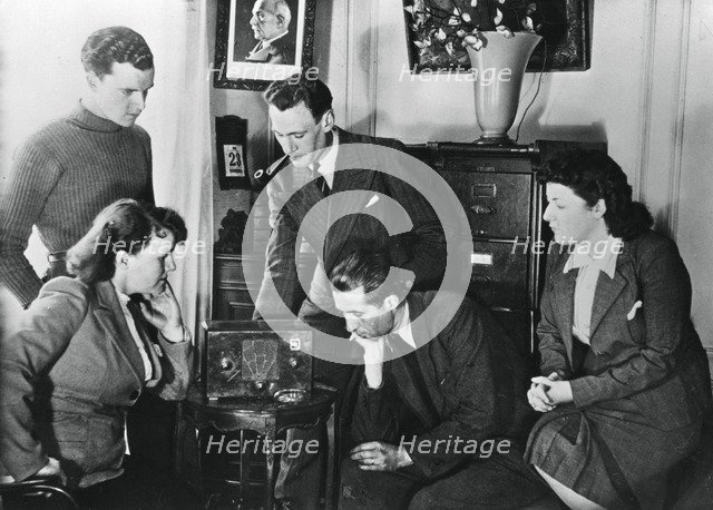 French citizens listening to a broadcast by Vichy deputy premier Admiral Darlan, 23 May, 1941. Artist: Unknown