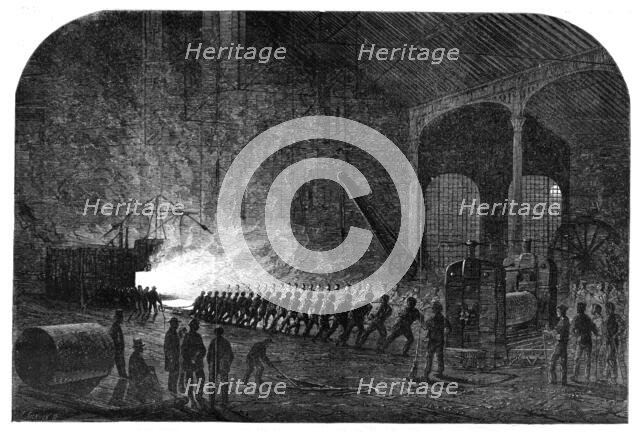 Process of rolling armour-plates for Her Majesty's ships at the Atlas Steelworks, Sheffield, 1861. Creator: Mason Jackson.