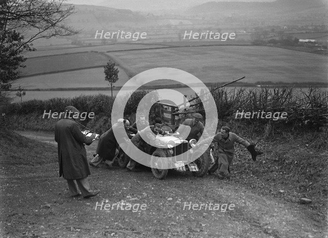 MG PB of K Scales getting a push during the MG Car Club Midland Centre Trial, 1938. Artist: Bill Brunell.