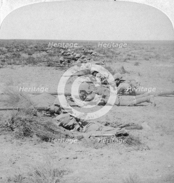 Wiltshire boys stealing on the enemy at the Orange River, South Africa, 2nd Boer War, 1900.  Artist: Underwood & Underwood